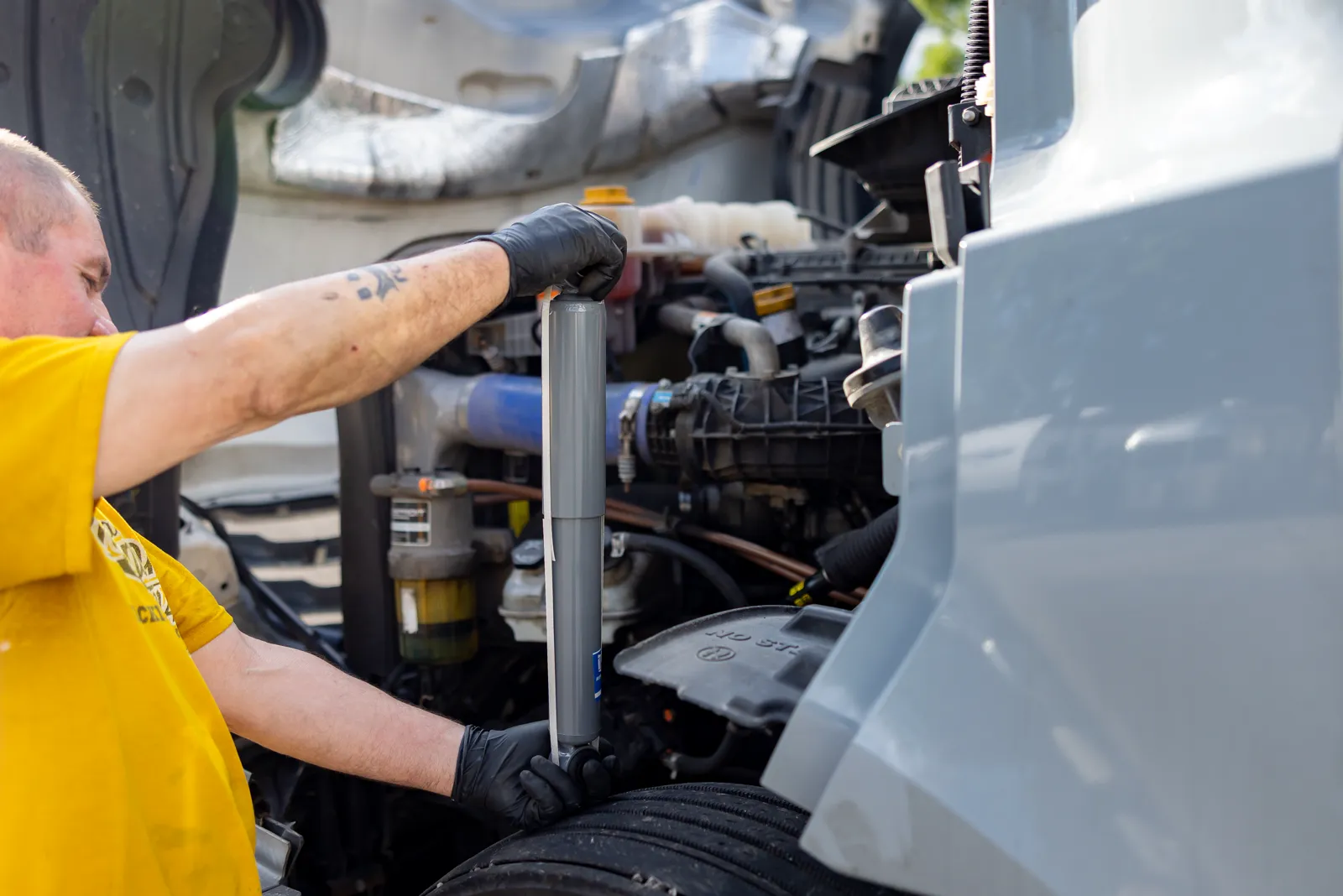 Truck Shark technician working on a semi truck engine in Long Grove, Illinois