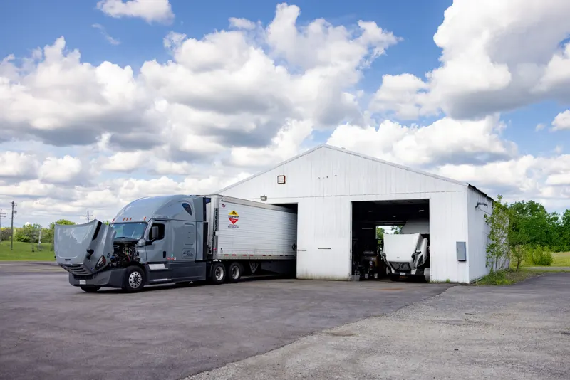 Semi truck and trailer outside the Truck Shark bays